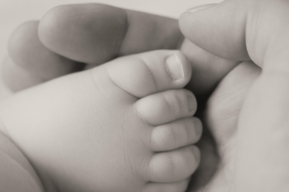 Baby barefoot black photo