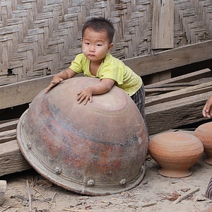 Boy clay pot myanmar photo