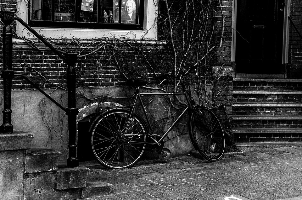 Abandoned bicycle black and white