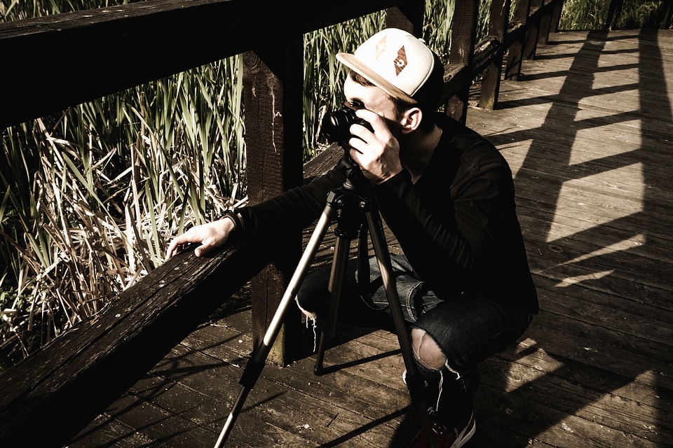 Camera grass plants man