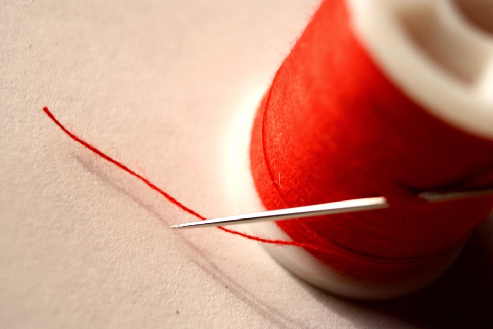 Red sewing sewing needle