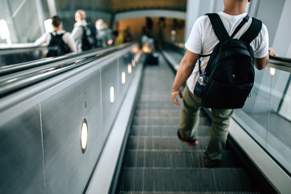 Crowd escalator luggage