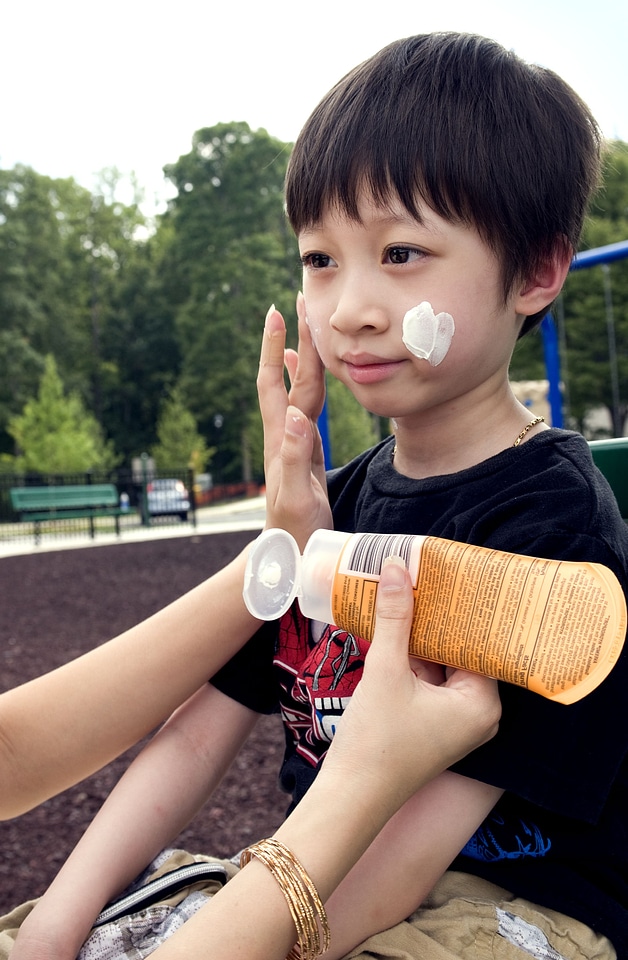 Boy coating mother