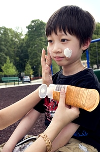 Boy coating mother