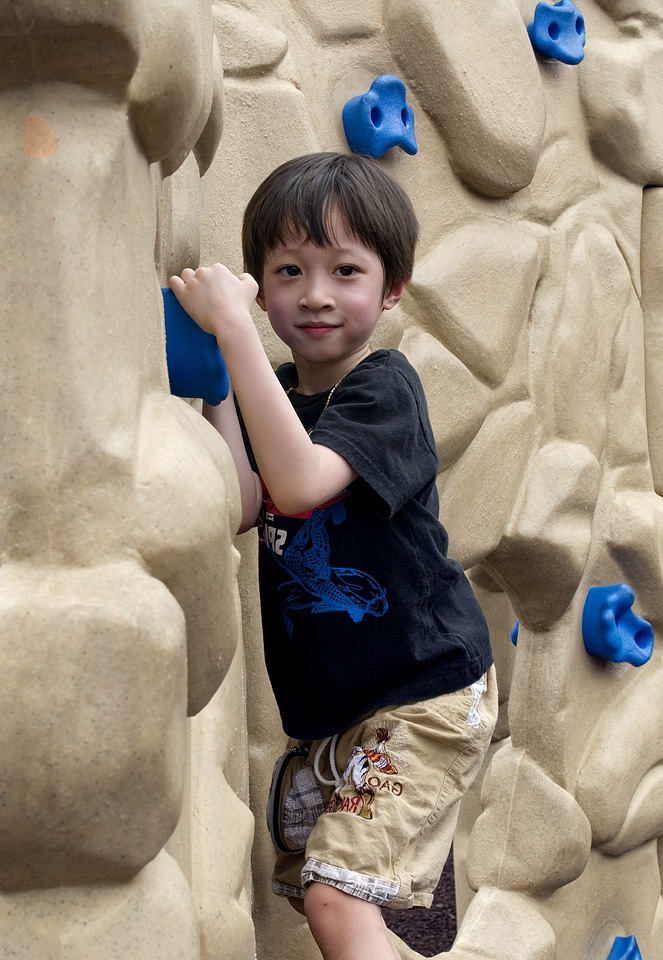 Boy climb rock
