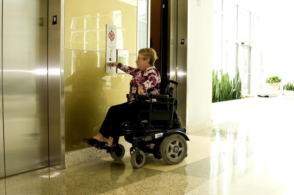 Button pressing wheelchair