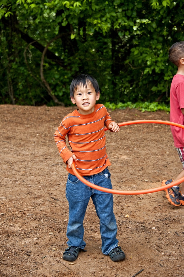Boy hula hoop spinning