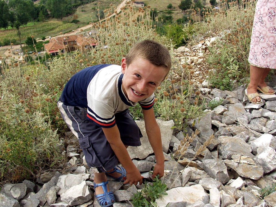 Boy collecting helping