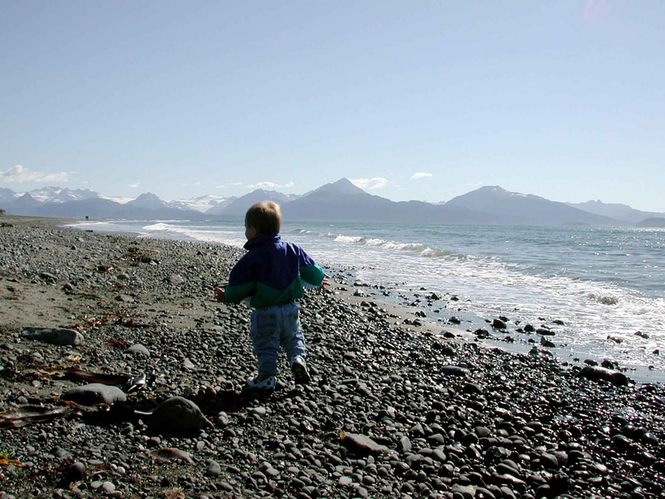 Boy running strand