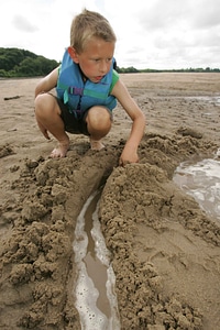 Boy playing sand
