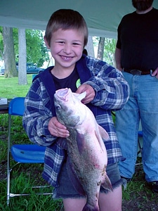 Boy fish holding