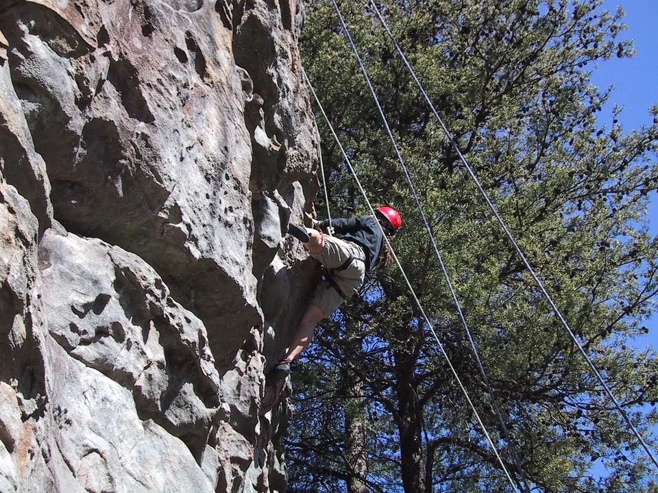 Climbing husband mountainside