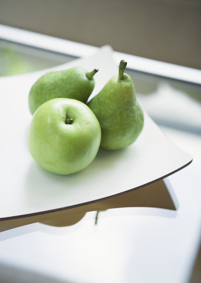 Green apple on table