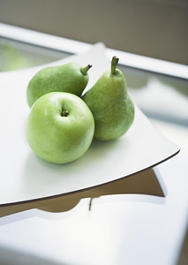 Green apple on table