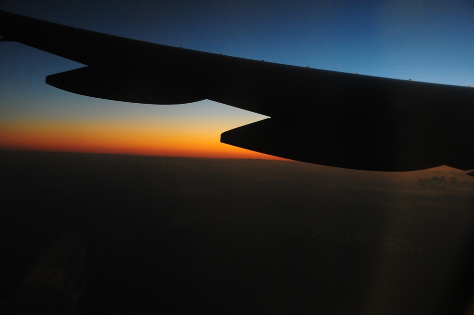 Wing of an airplane in the sunset