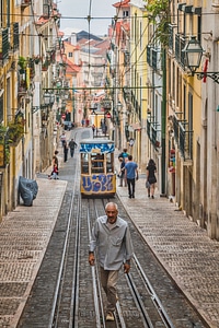 Romantic Lisbon street with the typical yellow tram photo