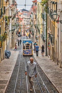Romantic Lisbon street with the typical yellow tram