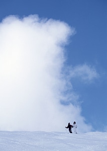 skiers skiing on fresh powder snow photo