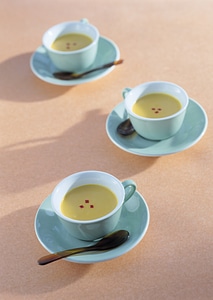 Three cream soup in white bowl photo