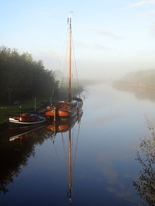 river and a boat scene during Fall season