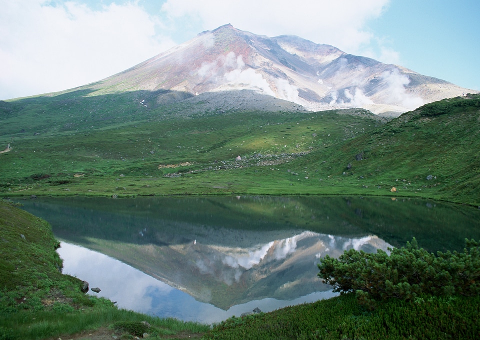 Mountain lake in background with high mountain