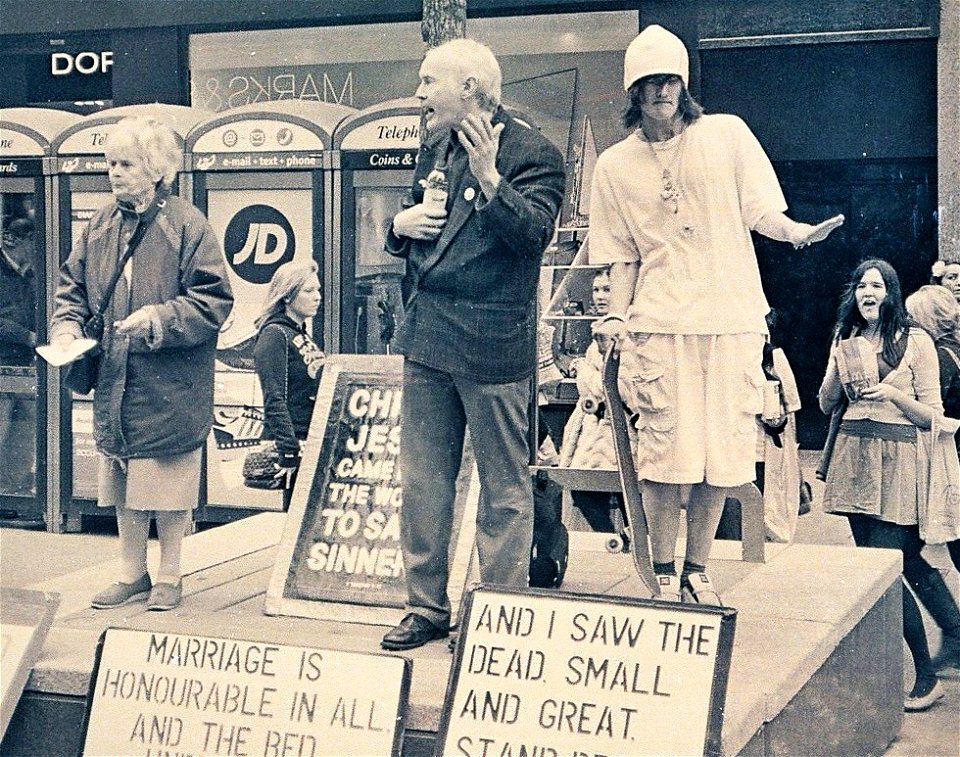 Street Preacher and Dancing Skater