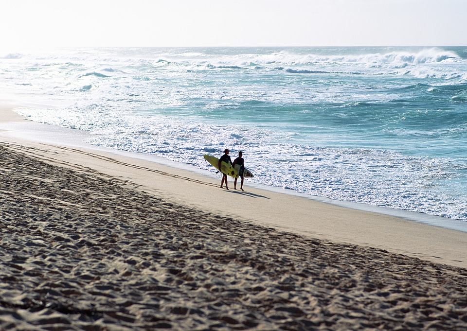Couple Lovers walking on the beach