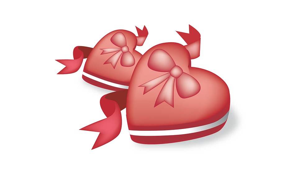 Two red hearts with gift box on background