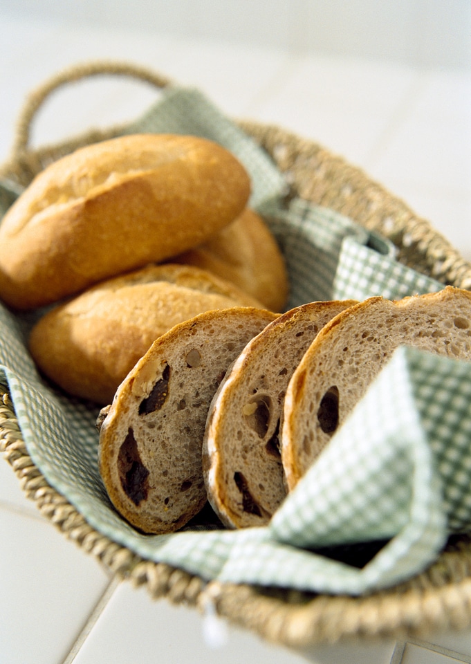 Composition with bread in wicker basket