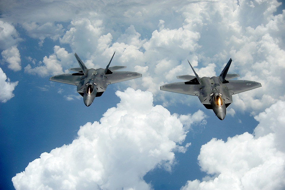 A pair of F-22 Raptors pulls away
