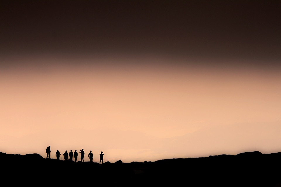Group of people on top of a mountain