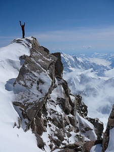 Man on top of mountain
