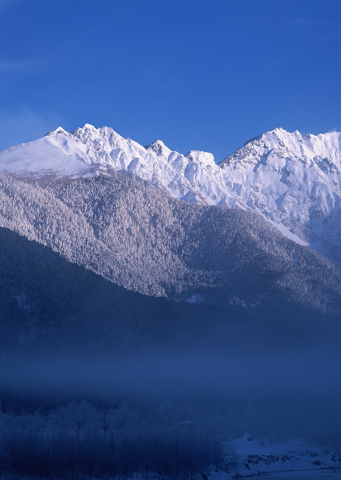 Mountain landscape with snow and clear blue sky