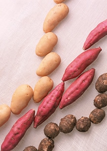 A variety of raw potatoes sweet potato and taro.