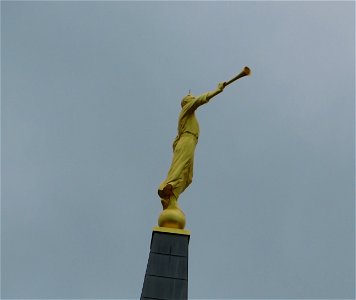 Golden Boy Trumpeter Atop The Steeple at the Church of Jesus Christ of Latter Day Saints in North Calgary photo