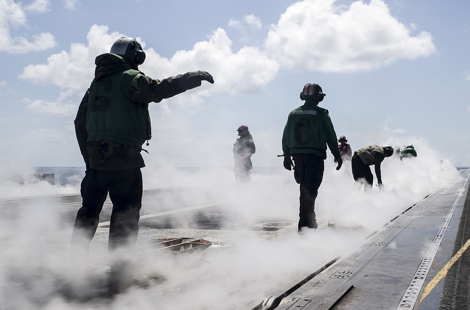 Sailors wrap the waist catapult