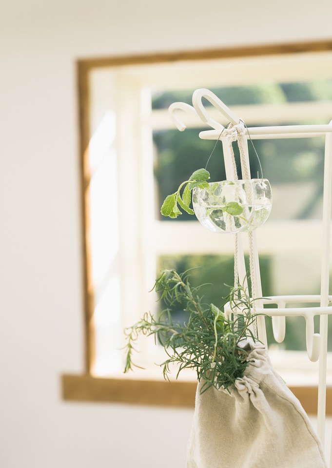 Rosemary bunch nestled inside a burlap bag and window