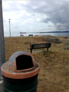 Trash can and the Pacific Ocean at Esquimalt British Columbia