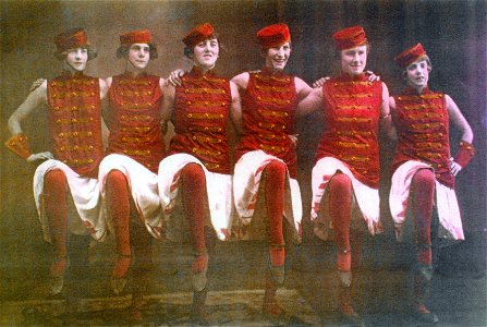 Dancing girls in military costume, [n.d.] photo