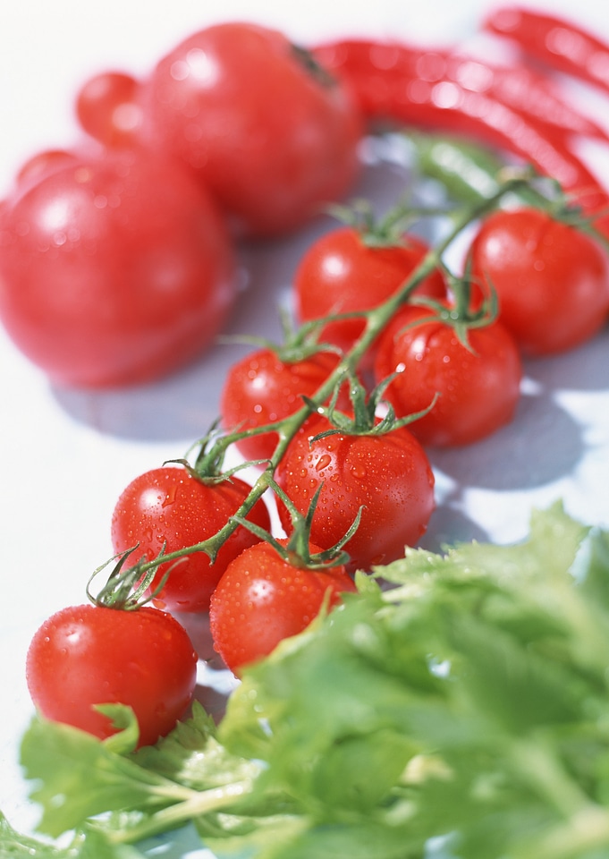 Cherry tomatoes with water drops on them.
