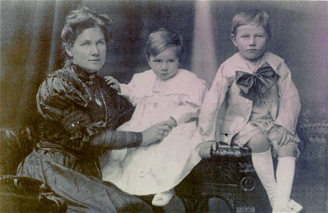 Mother and two young children - studio portrait photo