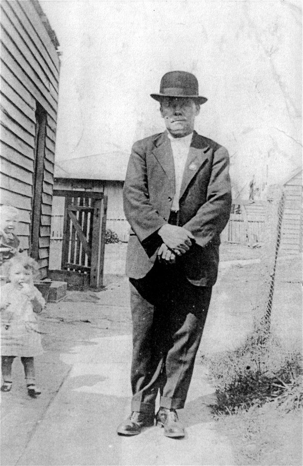 Two toddlers and a moustachioed gentleman, [n.d.] photo