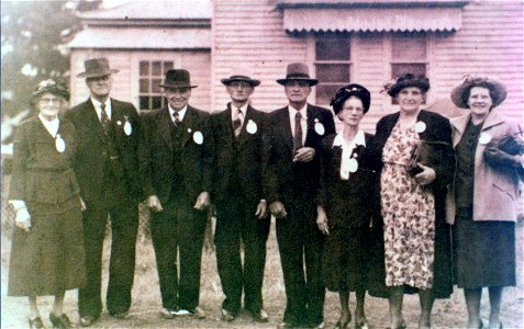 Group photo of four ladies and four gentleman, possibly in front of Abermain Public School, [n.d.]