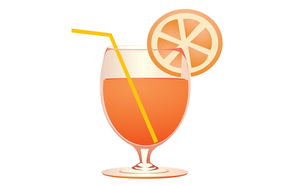 Amber cocktail in a glass isolated on a white background