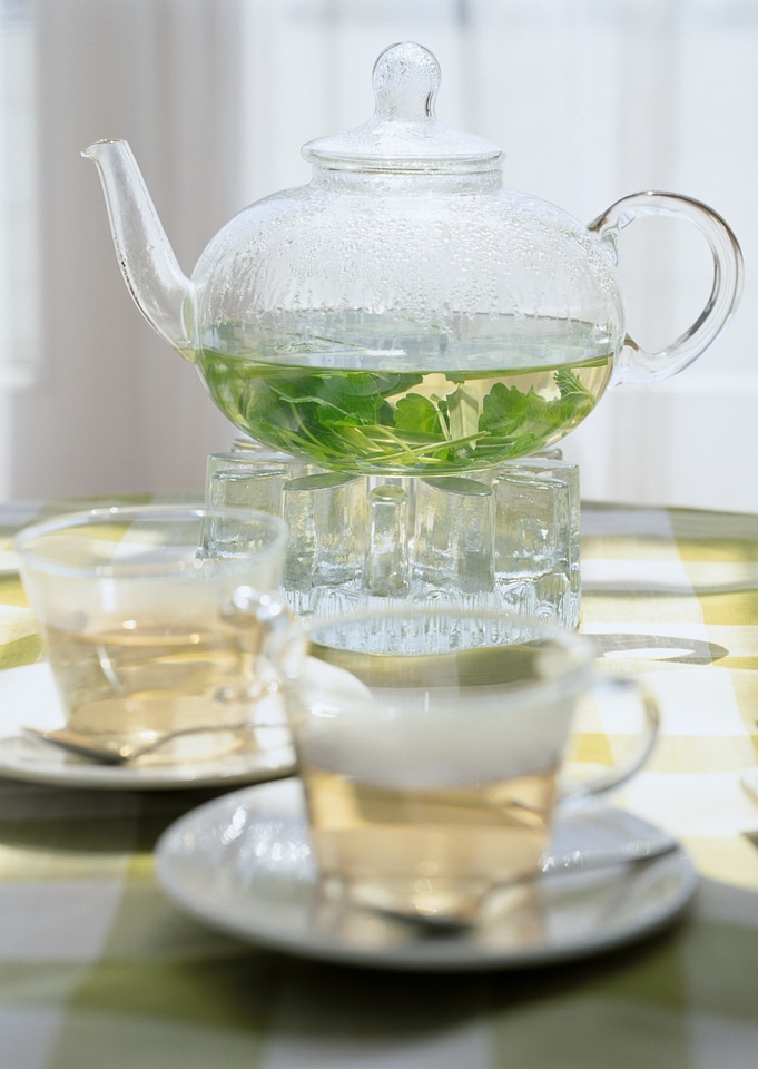 healthy green tea cup with tea leaves