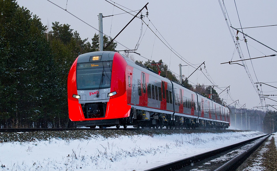 incoming suburban train in the misty winter