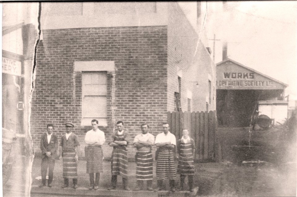 Seven gentlemen, some possibly butchers. [?] Works, Co-operative Society Ltd, [n.d.]