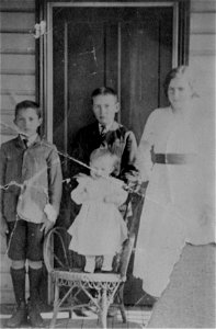 Family photo - one adult and three childrenm [n.d.] photo