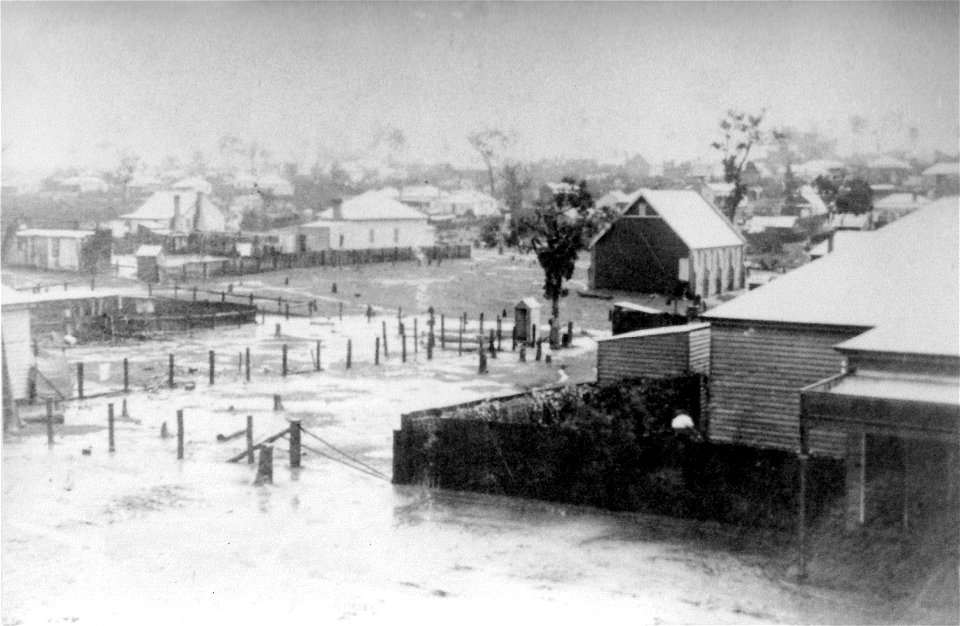 Flooded Coronation Street, Kurri Kurri, taken from the verandah of the Empire Hotel. Baptist Church in the centre background. , [n.d.] photo