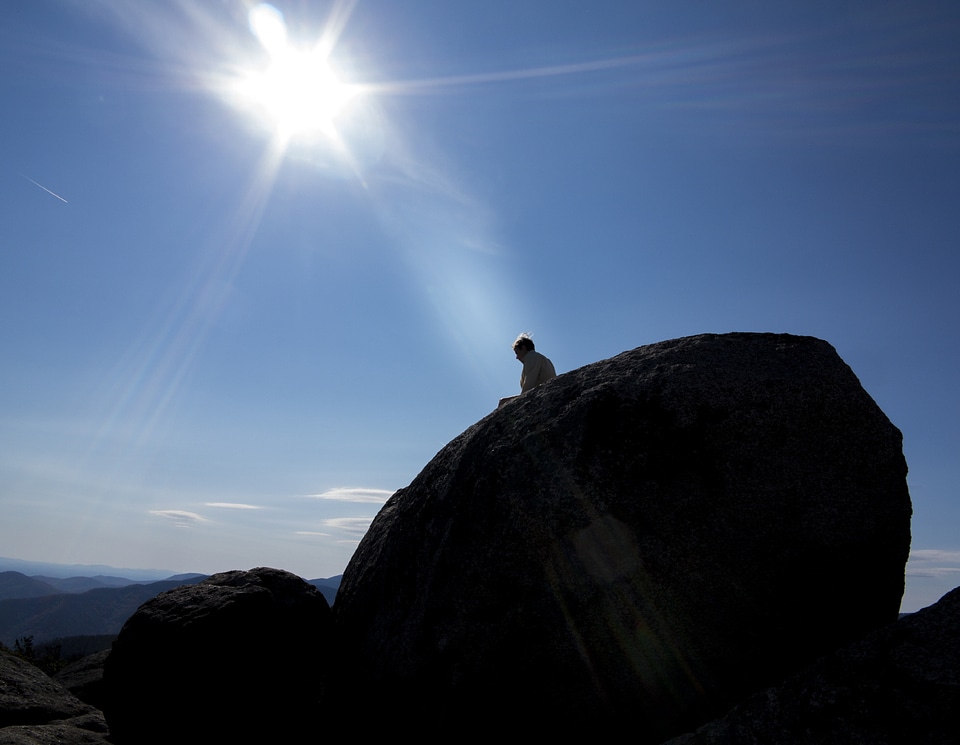climb to the top of a rock(shenandoah old rag Mt.)